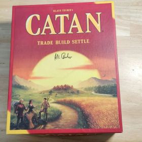 カタン(英語版) クラウス・トイバーのサイン入り